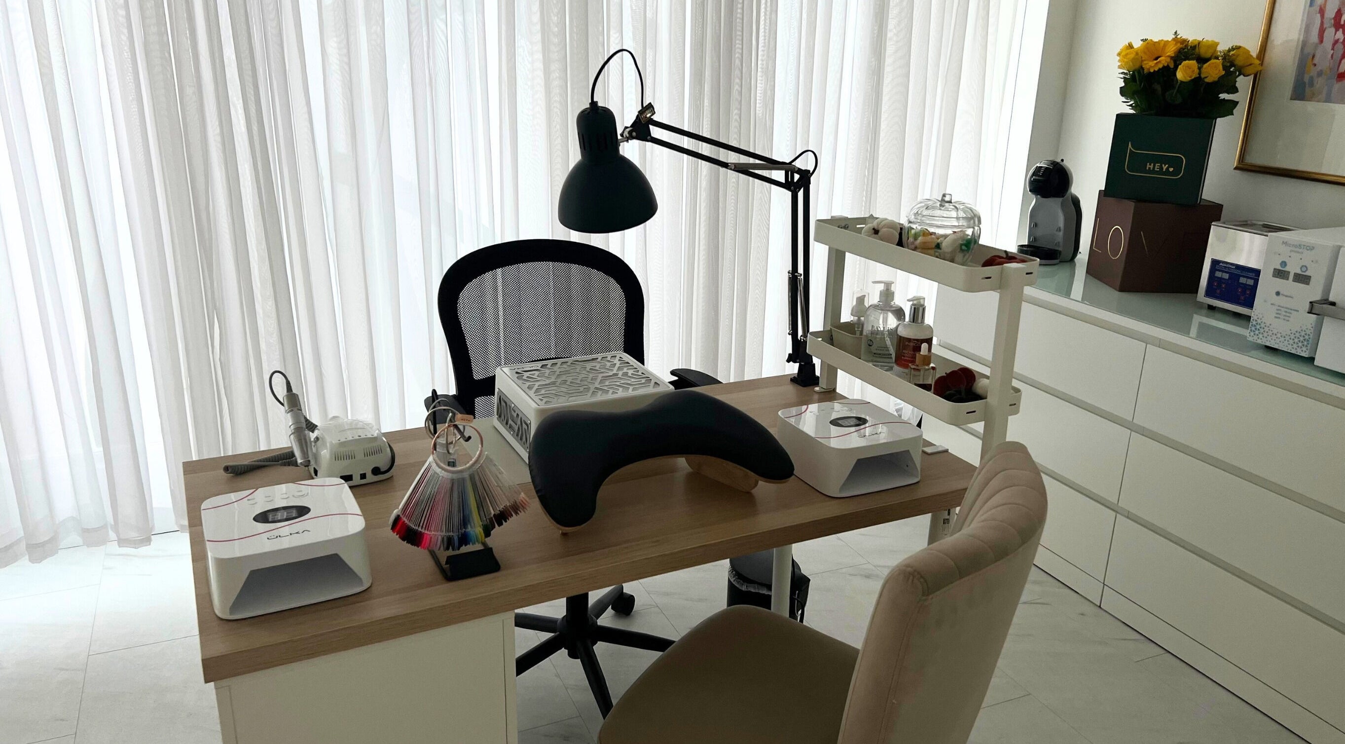 Elegant nail station at The Nail Muse by Tasha in Carlisle, England, GB, showcasing beauty tools and a cozy setup.