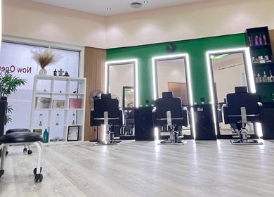 Interior of Eraya Beauty Salon in Dubai, AE featuring modern styling chairs and illuminated mirrors.
