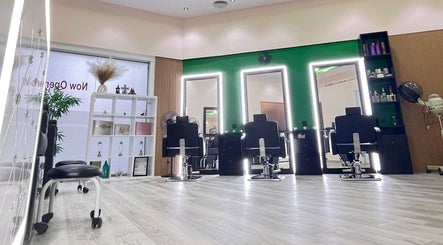 Interior of Eraya Beauty Salon in Dubai, AE featuring modern styling chairs and illuminated mirrors.