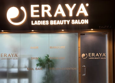 Illuminated entrance of Eraya Beauty Salon in Dubai, AE offering hair, manicure, and skincare services.