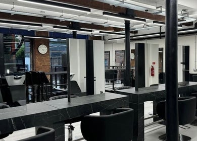Modern salon interior at Hairbykatieanna, Manchester, England, GB, showcasing sleek design and professional setup.