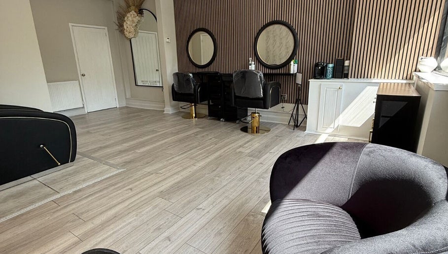 Chic interior of Gemini Hair in Birmingham, England, GB, with modern chairs and stylish decor.