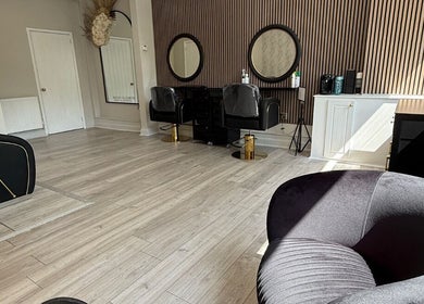 Chic interior of Gemini Hair in Birmingham, England, GB, with modern chairs and stylish decor.