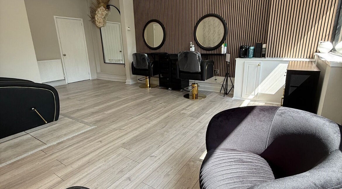 Chic interior of Gemini Hair in Birmingham, England, GB, with modern chairs and stylish decor.