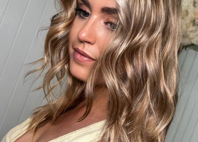 Woman with wavy blonde hair styled at Gemini Hair, Birmingham, England, GB.