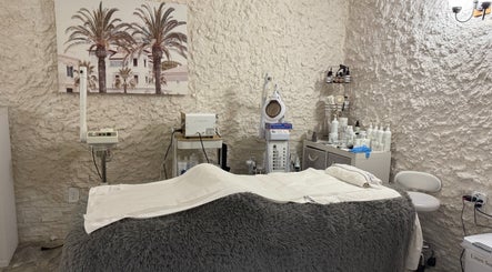 Treatment room at Brio Med Spa in Flowery Branch, Georgia, US with aesthetic equipment and cozy bed.