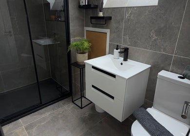 Modern bathroom in Glimmer & Glow Cleaning Services, Newtownards, Northern Ireland, GB with sleek fixtures.