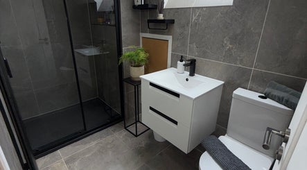 Modern bathroom in Glimmer & Glow Cleaning Services, Newtownards, Northern Ireland, GB with sleek fixtures.