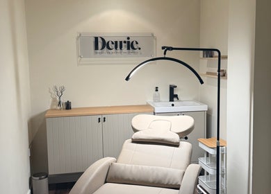 Relaxing treatment room at Dewie Skin, Nantwich, England, GB, featuring a comfortable reclining chair and modern decor.