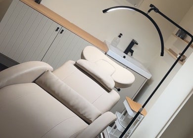 Relaxing treatment room at Dewie Skin, Nantwich, England, GB with a comfortable therapy bed.