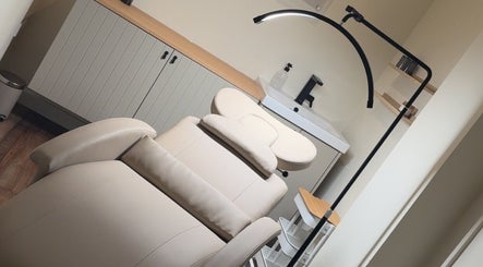Relaxing treatment room at Dewie Skin, Nantwich, England, GB with a comfortable therapy bed.