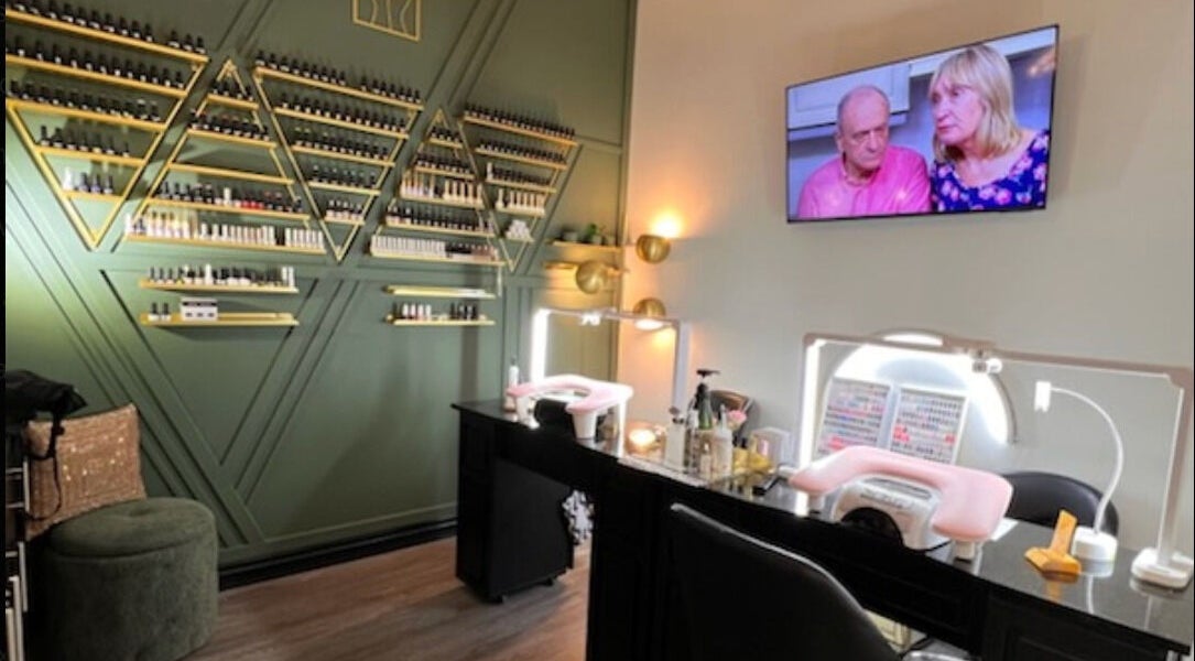 Chic nail salon interior at Shine Nails, Buffalo Grove, Illinois, US with stylish decor and nail polish display.