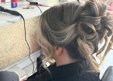 Elegant hairstyle at Chloe Newbold - makeup beauty, Liverpool, England, GB. Highlighting chic hair design.