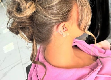 Stylish updo hairstyle at Chloe Newbold - makeup beauty, Liverpool, England, GB. Perfect for special events.