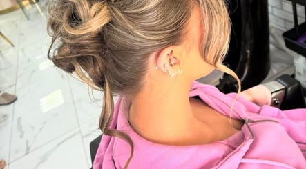 Stylish updo hairstyle at Chloe Newbold - makeup beauty, Liverpool, England, GB. Perfect for special events.