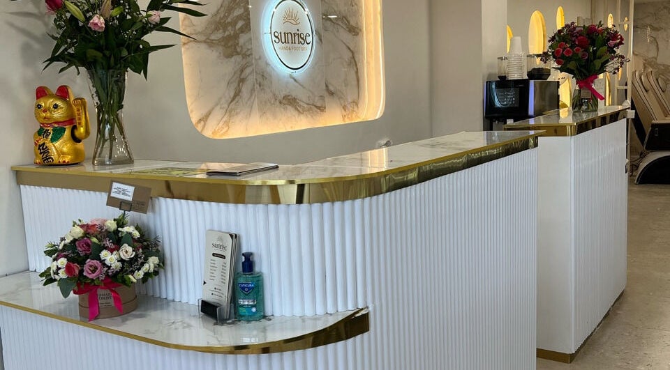 Reception area at Sunrise Hand & Foot Spa in Bray, County Wicklow, IE with elegant floral decorations.