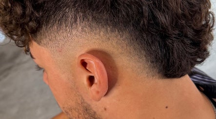 Close-up of a stylish fade haircut at D’n Cuts, Melbourne, Victoria, AU highlighting precise grooming.