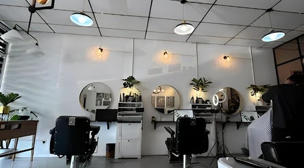 Interior of SIXTH BARBERSHOP in Shah Alam, Selangor, MY, featuring modern styling stations and chic decor.