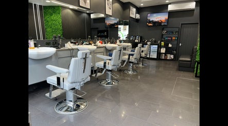 Interior of Db Barbers Tooting Bec in London, England, GB showcasing stylish barber chairs and modern decor.