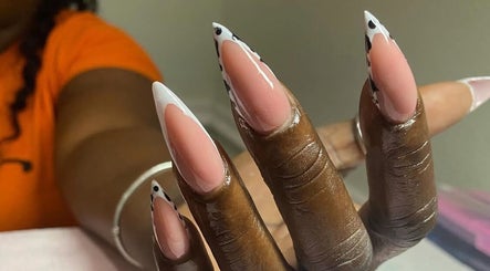 Chic nail art at Clawed By Grace, Freeport, Freeport, BS featuring glossy, pointed nails with intricate designs.