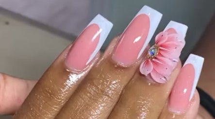 Elegant pink nails with floral art at Clawed By Grace, Freeport, Freeport, BS. Perfect for stylish looks.
