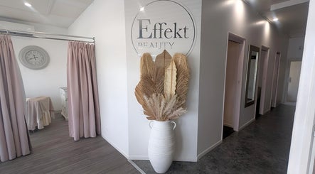 Effekt Skin Clinic entrance in Berserker, Queensland, AU with elegant decor and pastel curtains.