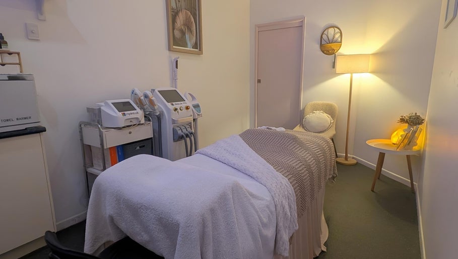 Effekt Skin Clinic treatment room in Berserker, Queensland, AU featuring cozy decor and high-tech equipment.