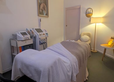 Effekt Skin Clinic treatment room in Berserker, Queensland, AU featuring cozy decor and high-tech equipment.