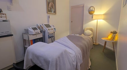 Effekt Skin Clinic treatment room in Berserker, Queensland, AU featuring cozy decor and high-tech equipment.
