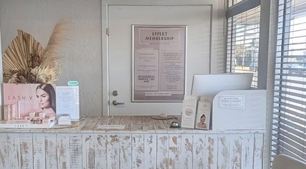 Effekt Skin Clinic reception desk in Berserker, Queensland, AU showcasing elegant display and marketing materials.