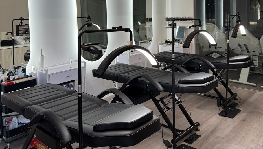 Modern treatment beds at Allure Artistry & Co, Melbourne, Victoria, AU ready for beauty sessions.
