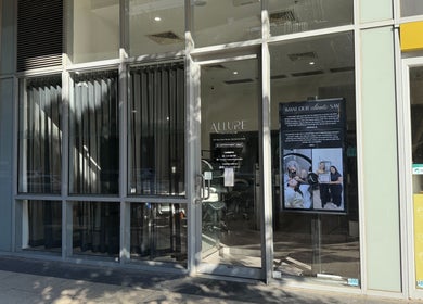 Exterior view of Allure Artistry & Co in Melbourne, Victoria, AU with stylish glass facade.