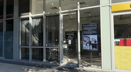 Exterior view of Allure Artistry & Co in Melbourne, Victoria, AU with stylish glass facade.