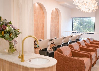 Elegant wash area at Lady K Hair Artistry in Bronte, New South Wales, AU, featuring modern decor and stylish chairs.
