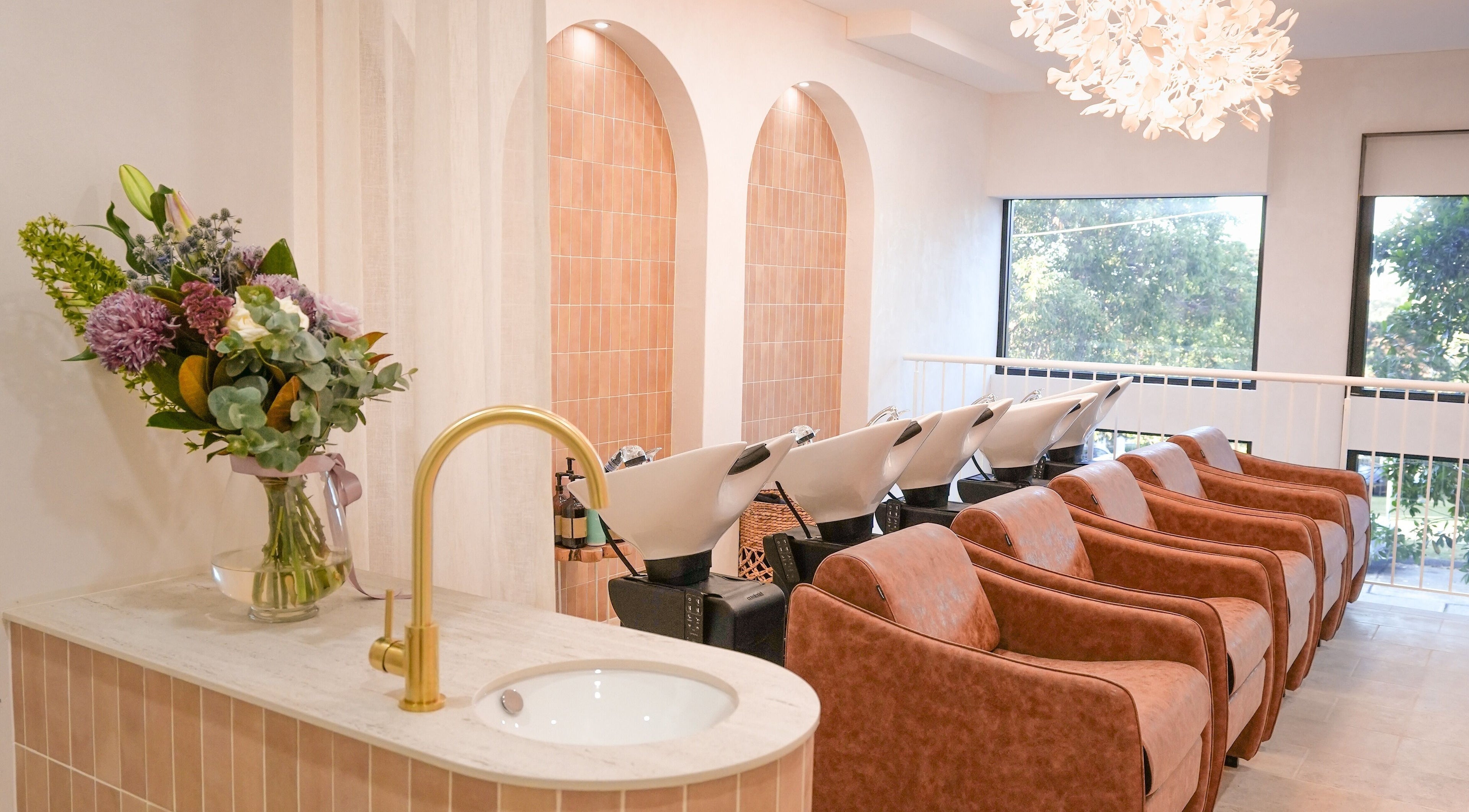 Elegant wash area at Lady K Hair Artistry in Bronte, New South Wales, AU, featuring modern decor and stylish chairs.