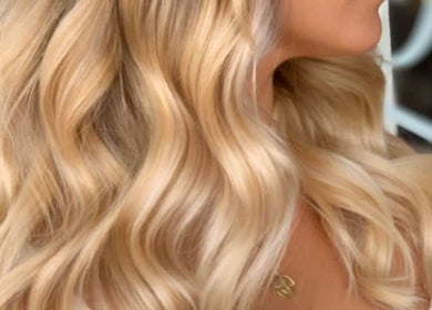 Flowing blonde hair styled in soft waves at Lady K Hair Artistry, Bronte, New South Wales, AU.
