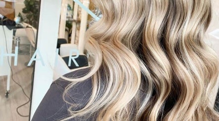 Blonde wavy hair styled at Lady K Hair Artistry, Bronte, New South Wales, AU, reflecting expert care and artistry.