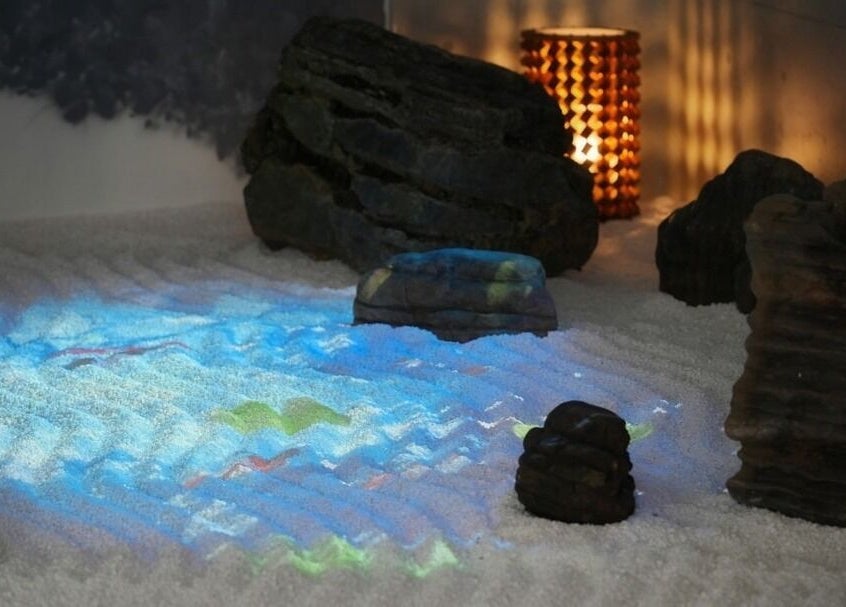 Serene zen garden ambiance at Othello, Kuala Lumpur, Wilayah Persekutuan Kuala Lumpur, MY with calming stone arrangement.