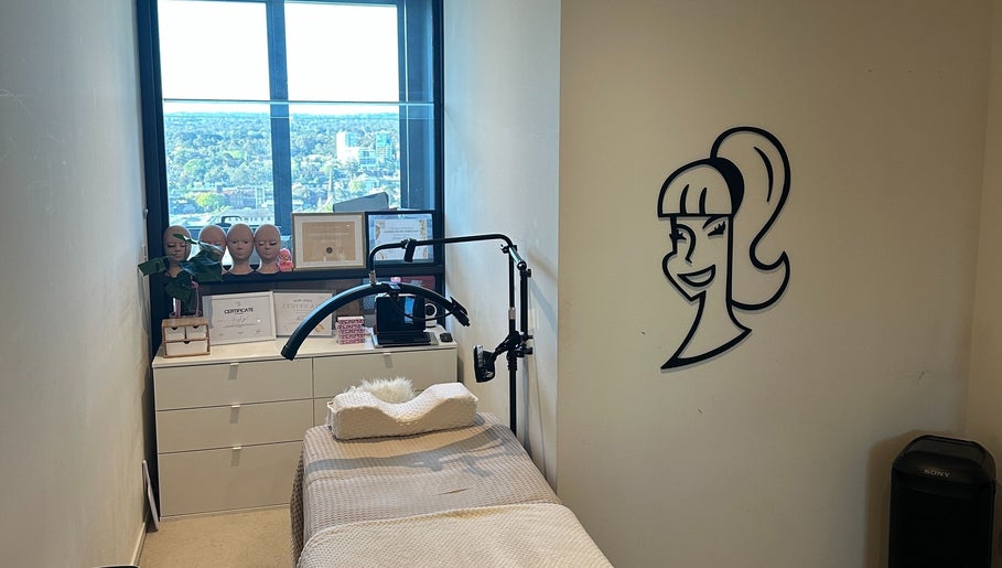 Treatment room with smiling decal at Amazing Audrey, Parramatta, New South Wales, AU. Offers a relaxing wellness environment.