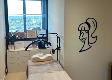 Treatment room with smiling decal at Amazing Audrey, Parramatta, New South Wales, AU. Offers a relaxing wellness environment.