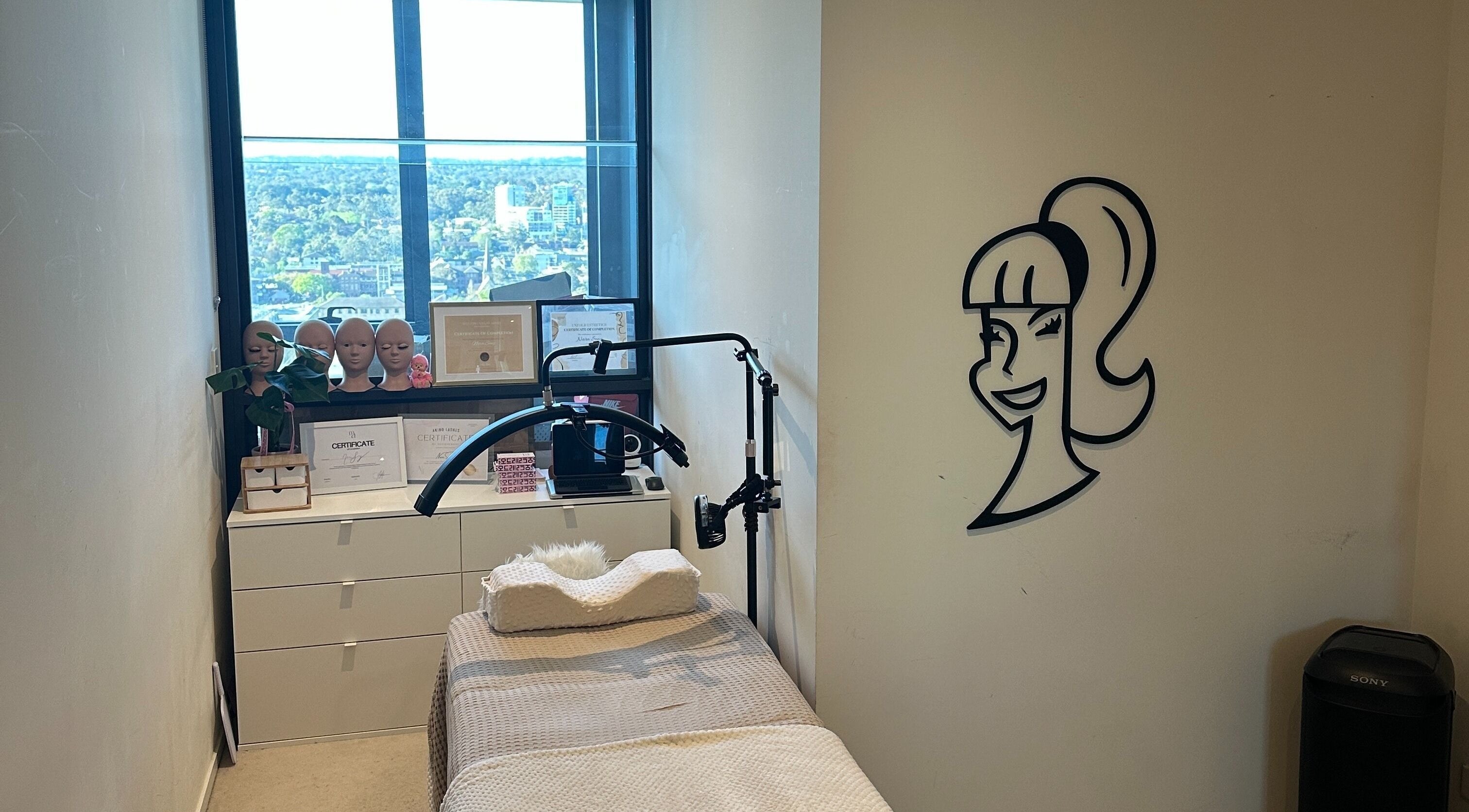 Tranquil treatment room at Amazing Audrey, Parramatta, New South Wales, AU with a city view.