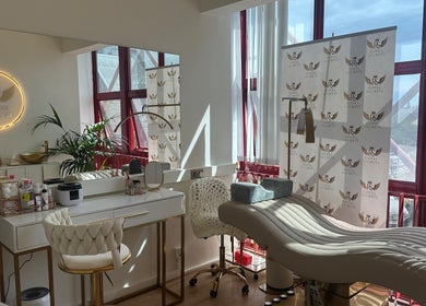 Luxurious beauty salon Royal Secrets in London, England, GB with plush chairs and modern decor.