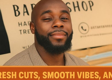 Smiling man with beard at Favour Barbershop, Thembisa, Gauteng, ZA showcasing fresh haircut.