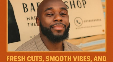 Smiling man with beard at Favour Barbershop, Thembisa, Gauteng, ZA showcasing fresh haircut.