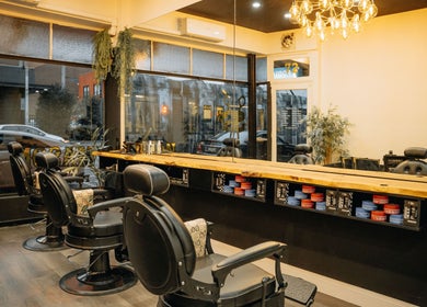 Elegant interior of Mason Barbershop in Melbourne, Victoria, AU, showcasing stylish barber chairs and decor.