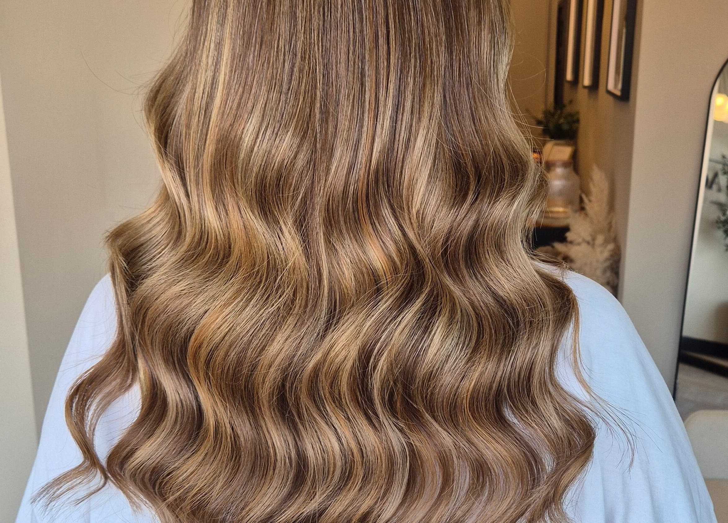 Beautiful wavy brown hair styled at Brushed Salon in Penarth, Wales, GB, showcasing salon's expertise.