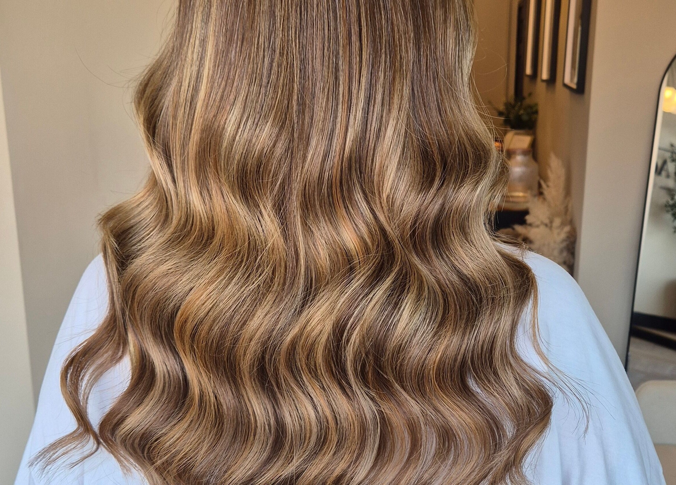 Beautiful wavy brown hair styled at Brushed Salon in Penarth, Wales, GB, showcasing salon's expertise.