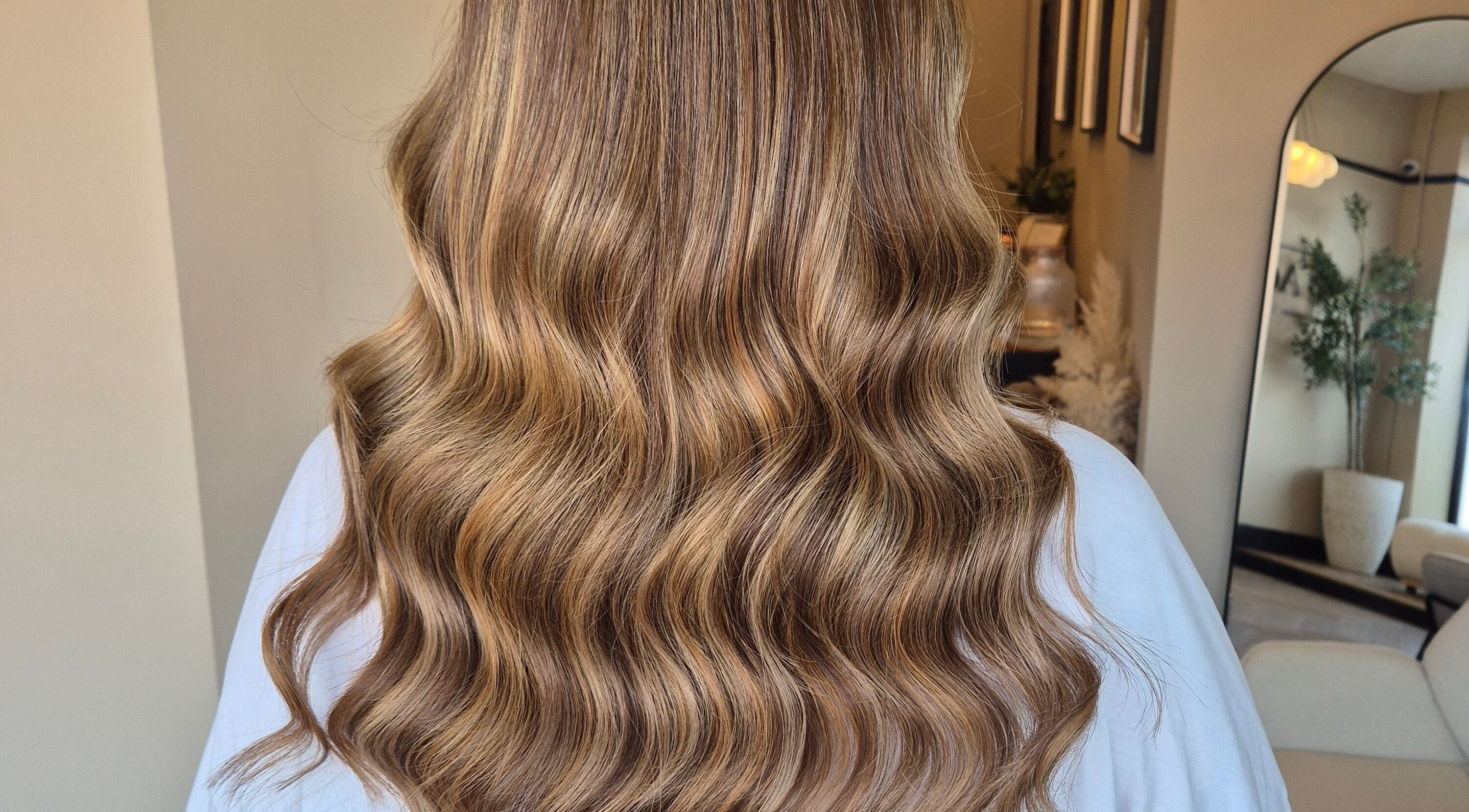 Beautiful wavy brown hair styled at Brushed Salon in Penarth, Wales, GB, showcasing salon's expertise.