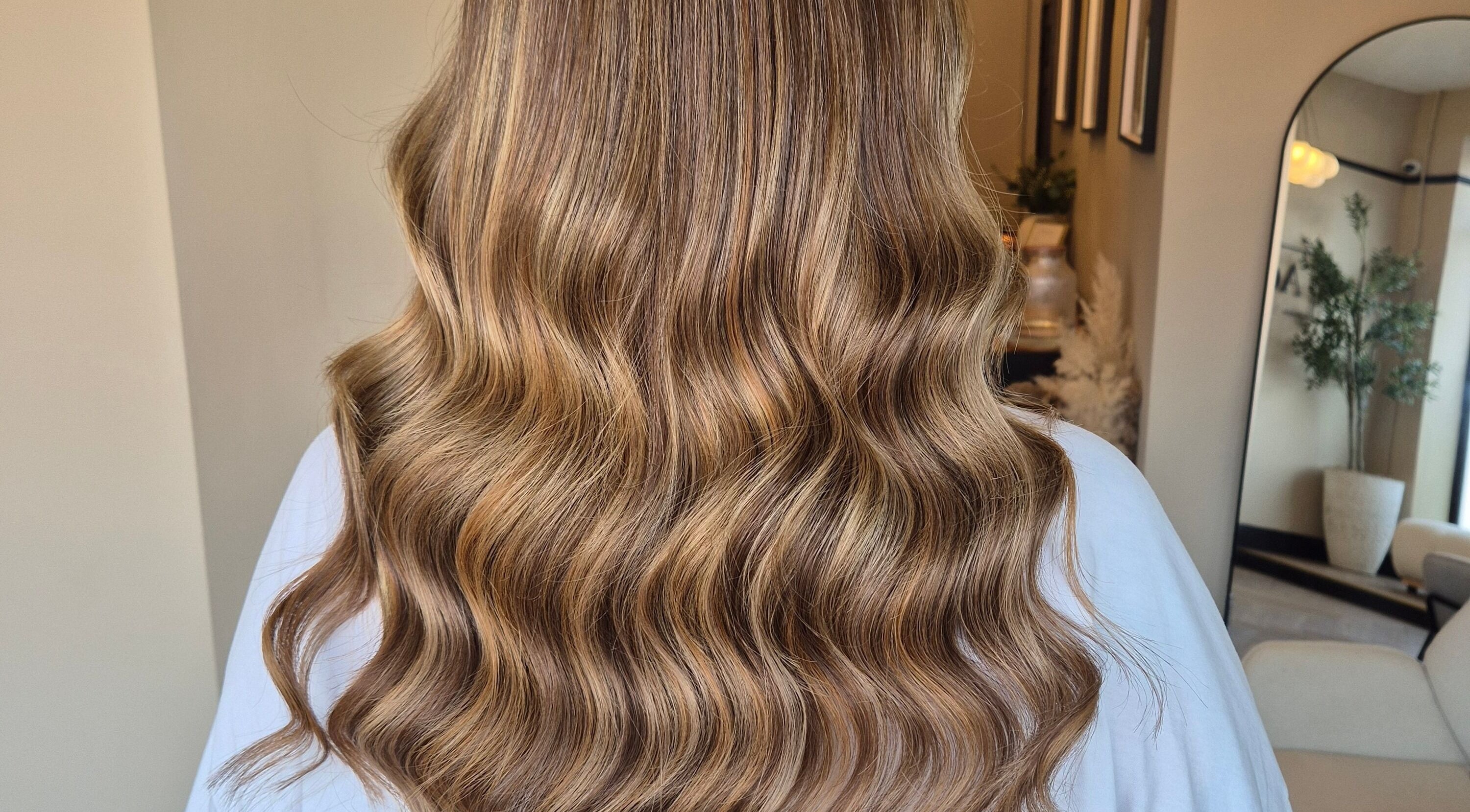 Beautiful wavy brown hair styled at Brushed Salon in Penarth, Wales, GB, showcasing salon's expertise.