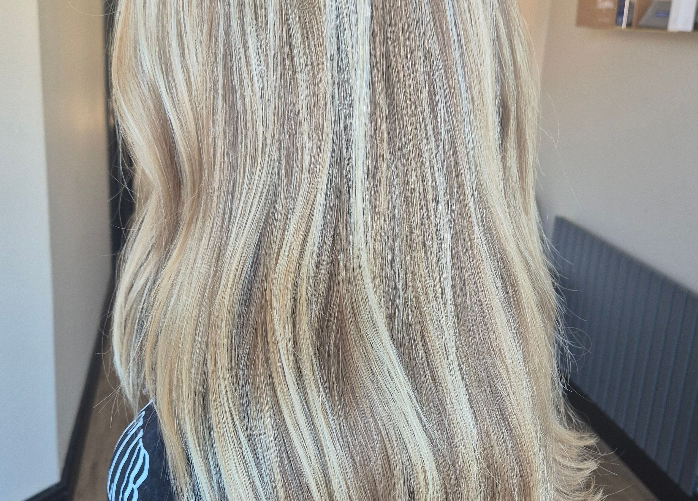 Blonde hair with golden highlights at Brushed Salon, Penarth, Wales, GB.